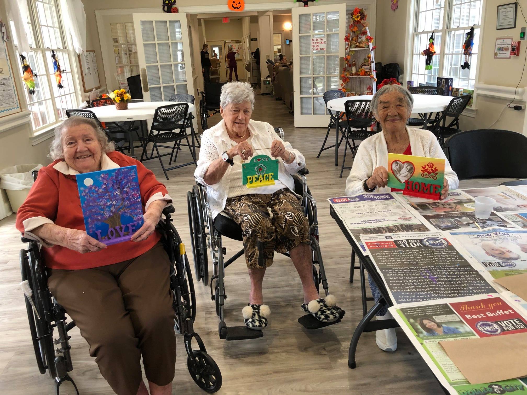 Senior showing off crafts they made